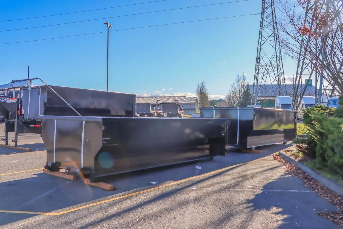 Roll-off dumpster ready for waste disposal at job site for Demolition Dumpster Rental in Elmira